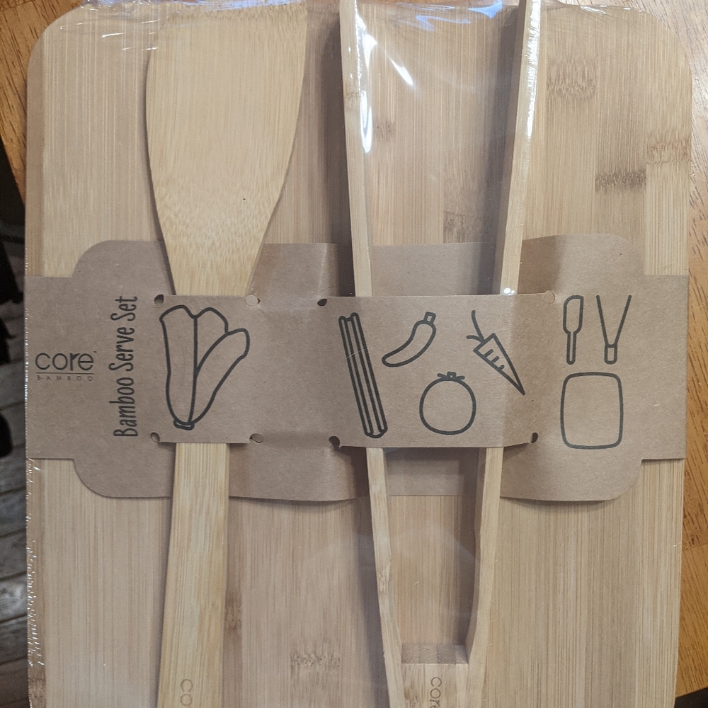 New bamboo cutting board with utensils